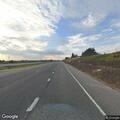 Pickup swerving on highway with dogs in truck bed