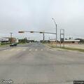 Slow-moving pickup pulling trailer on expressway