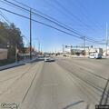 Unoccupied SUV blocks delivery truck at stop sign