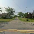 Traffic stop on silver Ford SUV at intersection