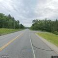 Car strikes moose on Route 115, woman injured