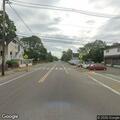 Two-car crash with fluids in road, no injuries