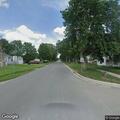 Loose dog running in roadway on West Court Street