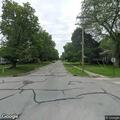Traffic stop on green sedan on Locust Street