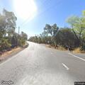 Car off roadway into embankment near Foothill