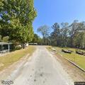 Tree limb sparking on power line at Harper Road