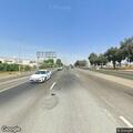 Pedestrian standing on Highway 99 on-ramp shoulder