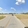 Board with nails creating traffic hazard on Gregg Lane
