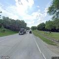 Hit-skip crash with fuel leak on Main Street
