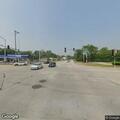 Officer stops red tractor trailer at highway junction