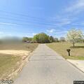 Elderly woman walking in roadway on Snowhill Church Rd