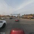 Disabled red vehicle missing tire on Ford and Wayne