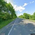 Telephone pole down with live wires across roadway
