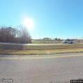 Officer with stopped gray pickup at Dew Road ramp