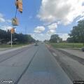 Person rollerblading in roadway at intersection