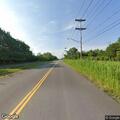 Suicidal woman reported near River Rd / Two Mile Creek in red vehicle