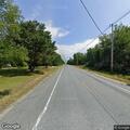 Vehicle passes stopped school bus in Surry