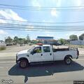 Two-car crash in gas station parking lot