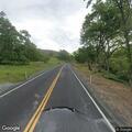 Reckless pickup crossing double lines on rural road