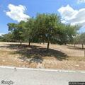 Dirt bikes racing through orange groves near Libby Road