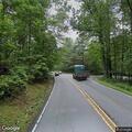 Crash with roadway debris on Rosman Highway