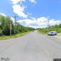 Vehicle off road on embankment in Madison