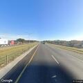 Vehicles stopped on I-10 shoulder near Lafayette