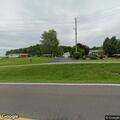Unsteady male pedestrian nearly falls on road in Tyner