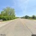 Erratic driver in red Toyota nearly hits motorcycle