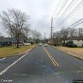 Vehicle knocks down road barricades on closed street