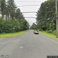 Two-car crash with fluid leak, no injuries
