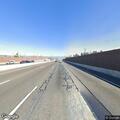 Car stopped in center divide on southbound I-215