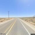 Person in 40s reports back pain on Pearblossom Hwy