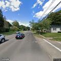 83-year-old man with leg pain at street intersection