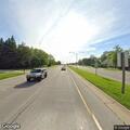 Disabled sedan with front damage in road median