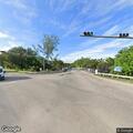 Reckless beige Toyota Camry on Memorial Highway