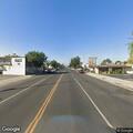 Pedestrian with cart on shoulder of 210 freeway