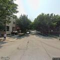 Suspicious men cover faces and hurry from alley