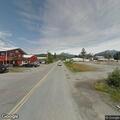Suspicious person with backpack near business