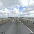 Traffic stop on white Chevy truck on causeway
