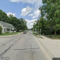 Male in camouflage standing in roadway at Jefferson and Fairground