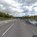 Stopped vehicle on westbound turnpike shoulder