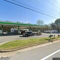 Person experiencing back pain at BP station