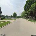 Pedestrian walking near ramp off 5th Street