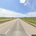Van with broken axle blocks lane on I-90