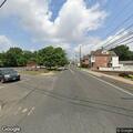 Person experiencing abdominal pain on Brook Street