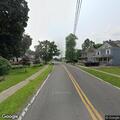 Out-of-control outdoor fire behind Minoa building