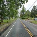 Car on shoulder causing lane merge on Peapack Road
