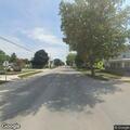 Traffic stop on red car with unreadable plate