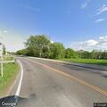 Small grass fire in roadside ditch near Cologne